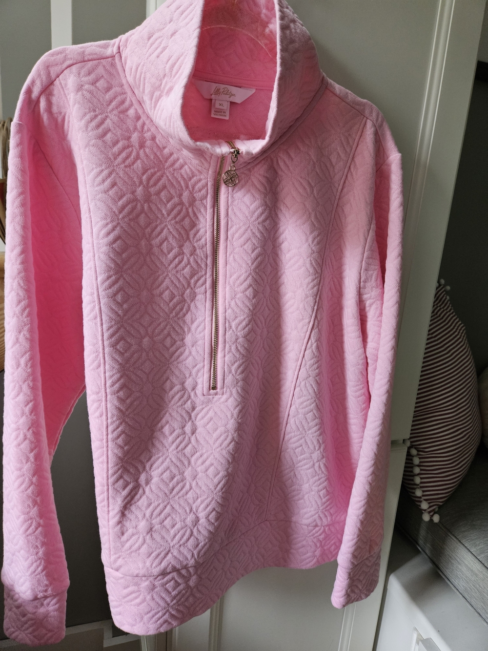 Lilly Pulitzer Eleni pullover features a quilted butterfly pattern
